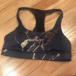 Black and gold sports bra